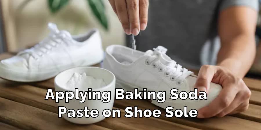 Applying Baking Soda Paste on Shoe Sole