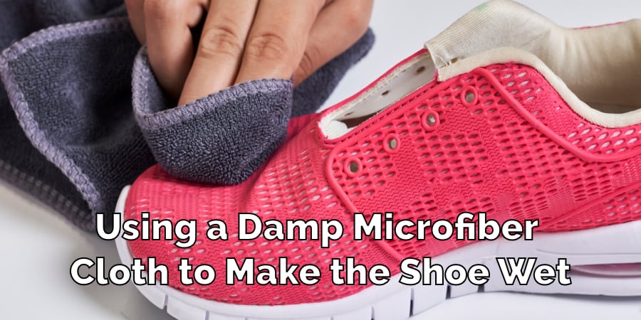 Using a Damp Microfiber Cloth to Make the Shoe Wet